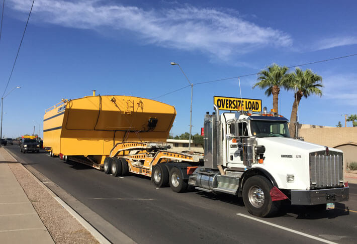 transport truck hauling an off highway comoponent 