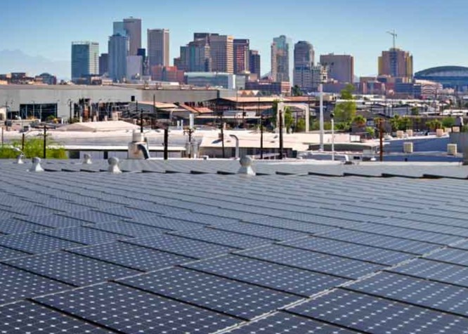 solar panels in front of city scape