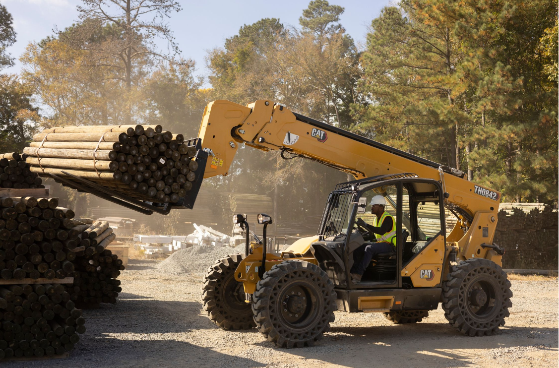 Telehandler lifting wood beams