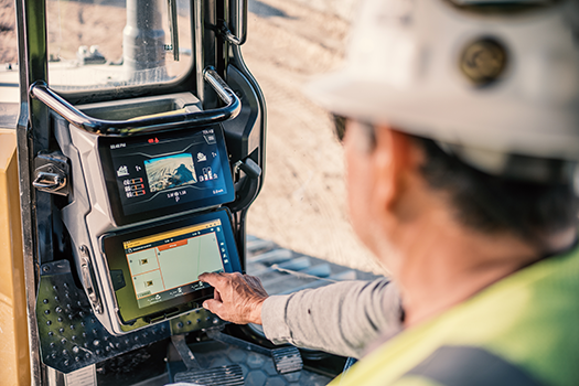 operator using in cab technology screen