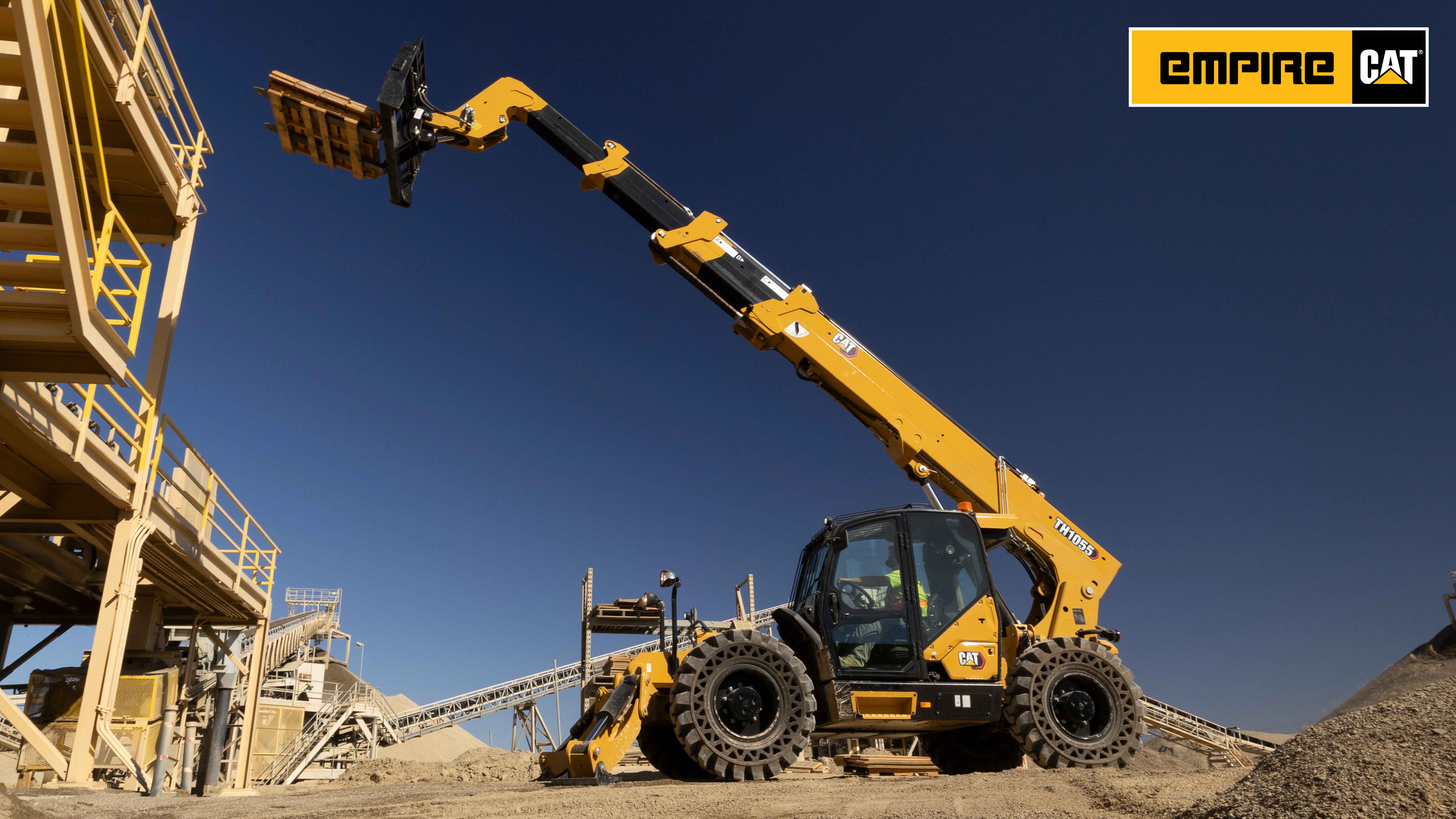 Telehandler lifting wood pallet