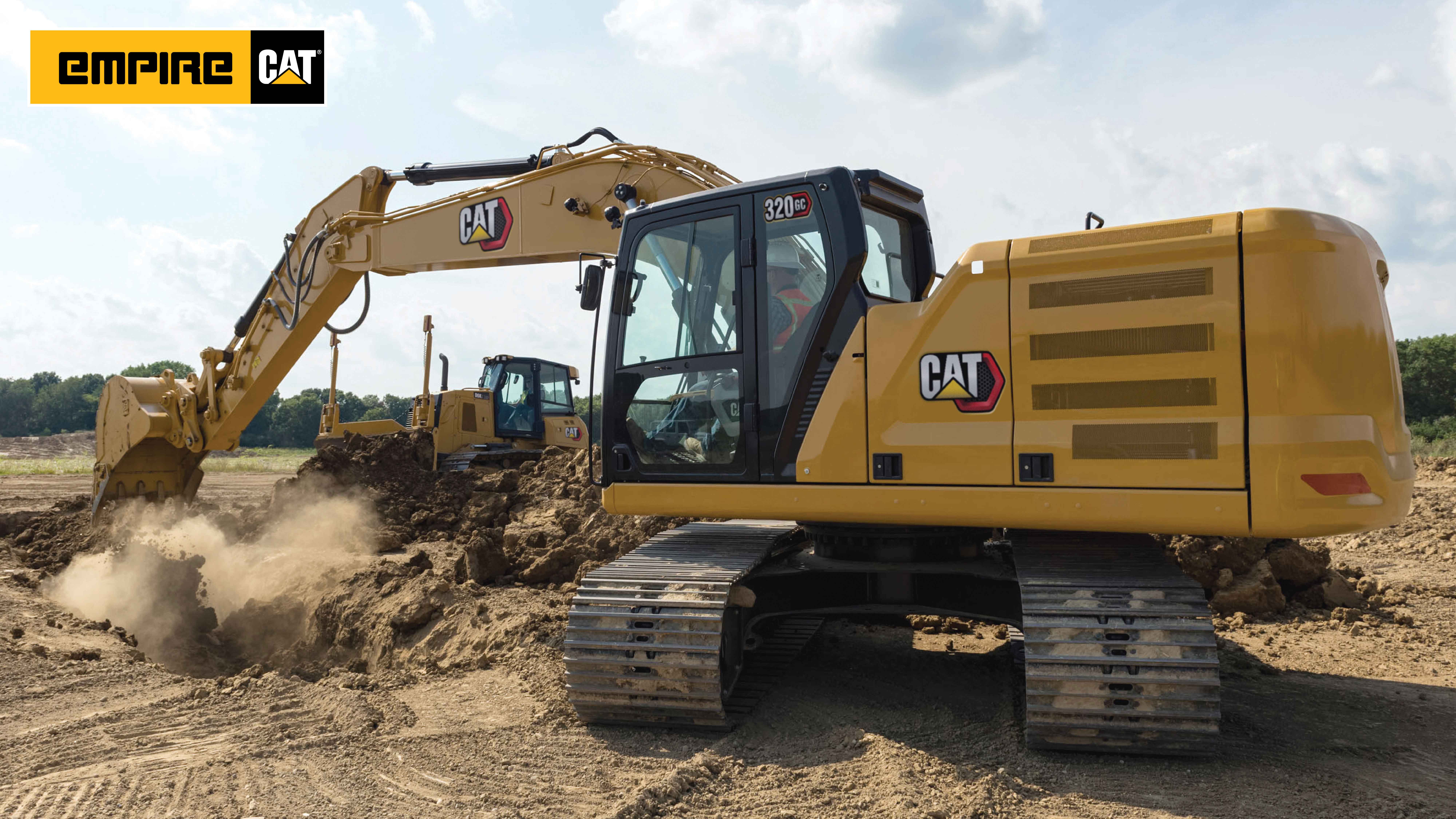 excavator and dozer in desert digging a large hole
