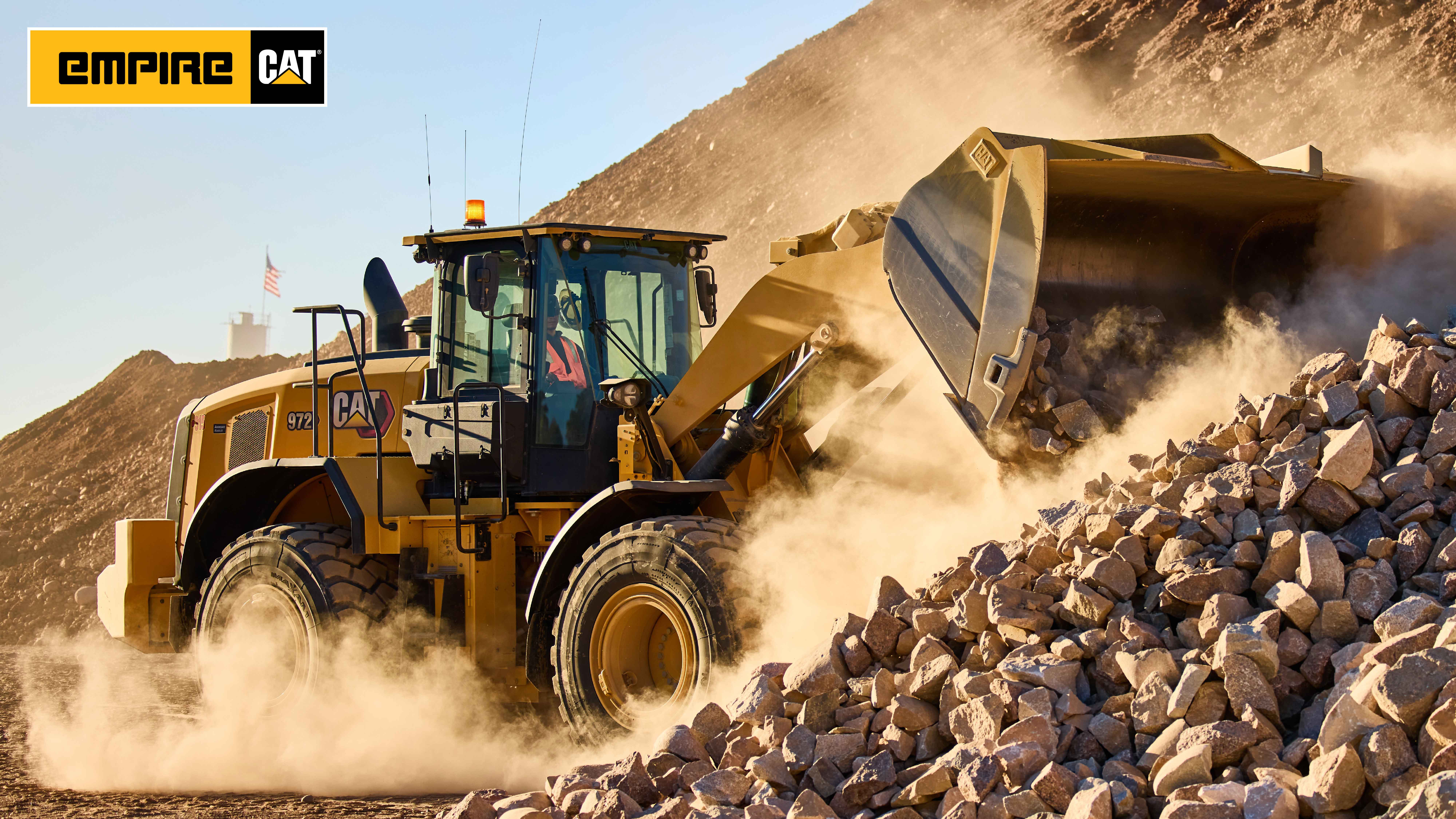 wheel loader unloading large rocks from bucket