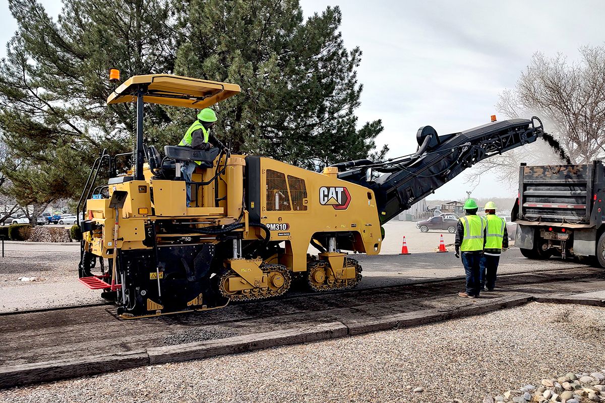 cold planer moving through broken road